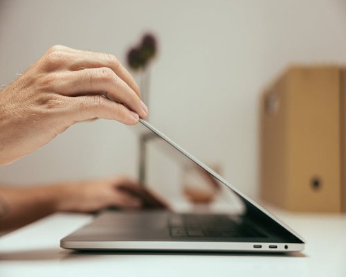 A clean desk with a closed laptop marking the end of the work day